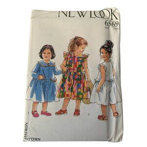 New Look 6569 Sewing Pattern Girl's Dress Sundress Jumpsuit Romper Age 3 to 8